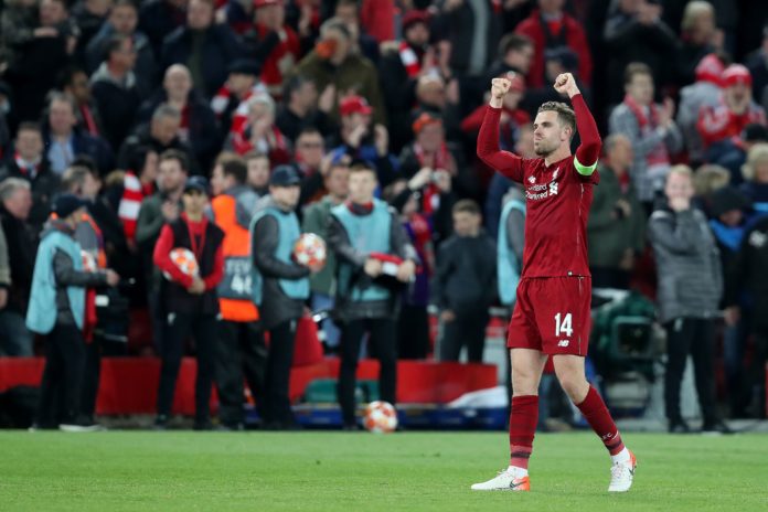 Jordan Henderson with Liverpool celebrates a 4-0 victory over FC Barcelona in 2019