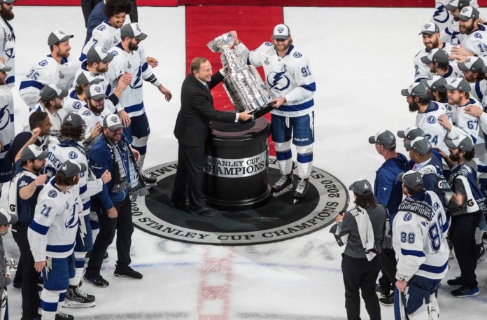 Tampa Bay Lightning's Steven Stamkos presented the Stanley Cup from NHL commissioner Gary Bettman in September 2020.