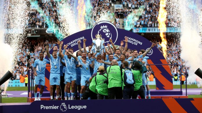 Manchester City lifting the trophy during the Premier League match between Manchester City and Aston Villa in May 2022