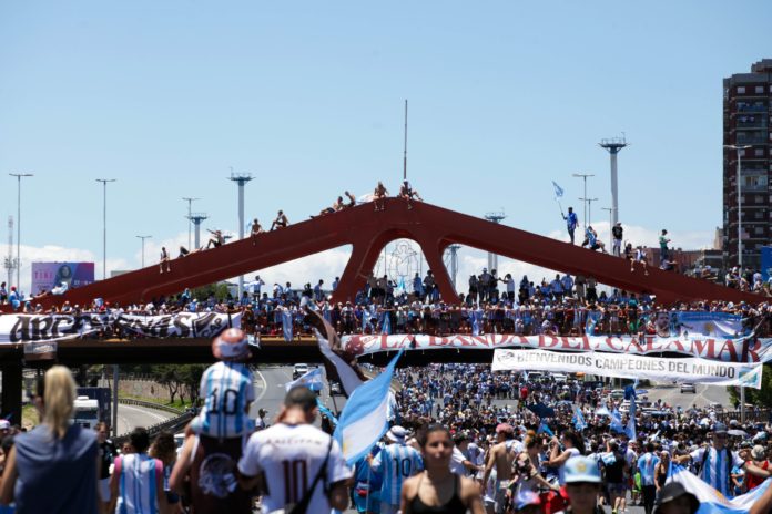 Fans of Argentina at a victory parade of the Argentina men's national football team after winning the FIFA World Cup Qatar 2022