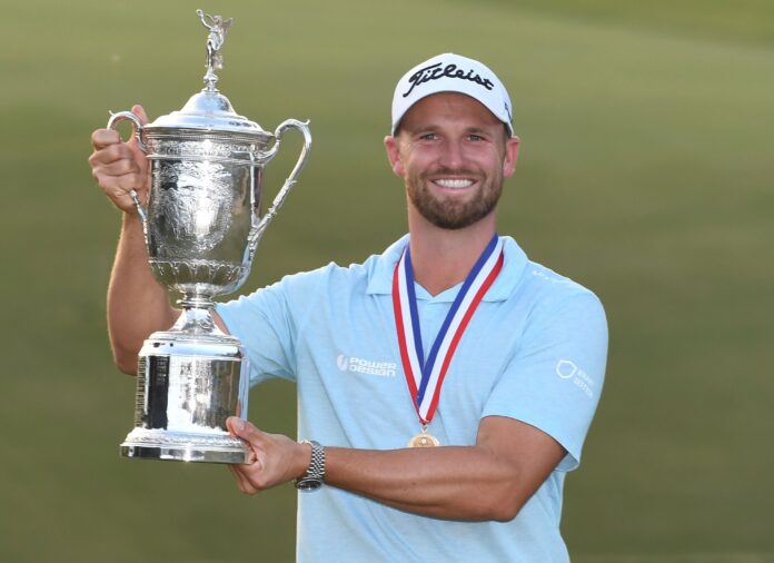 Wyndham Clark celebrates with his trophy after winning the 2023 U.S. Open Golf Championship in June 2023