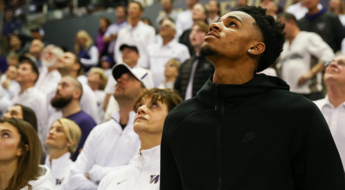 Dejounte Murray attending a college basketball game in 2019