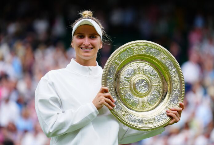 Marketa Vondrousova lifts the Venus Rosewater Dish after victory in the Ladies' Singles final Wimbledon Tennis Championships in July 2023